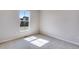 Bright bedroom with carpeted floor and a large window at 9973 Worchester St, Commerce City, CO 80022