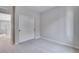 Carpeted bedroom features neutral walls and a closet, with an open doorway looking into the hallway at 9973 Worchester St, Commerce City, CO 80022
