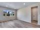 Bright bedroom featuring large window offering neighborhood views at 9973 Worchester St, Commerce City, CO 80022