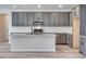 Modern kitchen featuring gray cabinets, granite countertops and stainless steel appliances at 9973 Worchester St, Commerce City, CO 80022