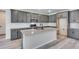 Modern kitchen featuring gray cabinets, granite countertops and a functional center island at 9973 Worchester St, Commerce City, CO 80022