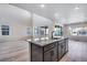 Modern kitchen with granite countertops, center island and access to living room at 9973 Worchester St, Commerce City, CO 80022