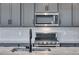 Beautiful kitchen with stainless steel microwave, oven and granite countertops at 9973 Worchester St, Commerce City, CO 80022