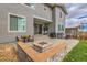 Backyard with a patio, a built-in fire pit, an outdoor grill and a hot tub at 17630 W 94Th Dr, Arvada, CO 80007