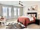 Bright bedroom with lots of windows, stylish furnishings and a comfortable atmosphere at 17630 W 94Th Dr, Arvada, CO 80007