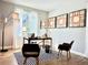 Bright home office with a modern desk, stylish decor, and a checkered rug at 17630 W 94Th Dr, Arvada, CO 80007