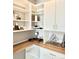 Built-in home office shelving and desk area with stylish decorative items on display at 17630 W 94Th Dr, Arvada, CO 80007