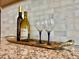 Elegant kitchen with granite countertop showcasing wine and wine glasses on a tray at 17630 W 94Th Dr, Arvada, CO 80007
