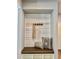 Mud room niche with built in bench and storage with white plank wall at 17630 W 94Th Dr, Arvada, CO 80007