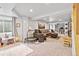 Large basement with a plush carpet, a brown sofa and ottoman, and a playful area at 6324 Winona St, Arvada, CO 80003