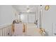 Bright bedroom with two large closets, an alphabet decal, and a comfortable seating area at 6324 Winona St, Arvada, CO 80003