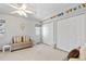 Bright bedroom with natural lighting and 2 large closets with an alphabet decal above at 6324 Winona St, Arvada, CO 80003