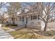 Inviting two-story home with a cozy front porch, perfect for enjoying the outdoors at 6324 Winona St, Arvada, CO 80003