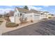 Charming home featuring a two-car garage and a cozy, fenced yard for outdoor enjoyment at 6324 Winona St, Arvada, CO 80003