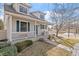 Charming two-story home with a covered front porch and manicured landscaping at 6324 Winona St, Arvada, CO 80003