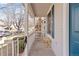 Inviting front porch with seating, enhancing the curb appeal of this charming residence at 6324 Winona St, Arvada, CO 80003