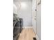 Modern laundry room with front loading washer and dryer at 6324 Winona St, Arvada, CO 80003