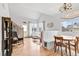 Bright living space featuring hardwood floors, comfortable seating, and natural light from the large windows at 6324 Winona St, Arvada, CO 80003