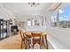 Inviting living space boasts natural lighting, hardwood floors, and comfortable seating at 6324 Winona St, Arvada, CO 80003