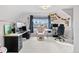 A spacious office with a neutral palette, large windows, and multiple workstations at 6324 Winona St, Arvada, CO 80003