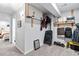 Organized storage room with shelving, hanging storage, and access to the living space at 6324 Winona St, Arvada, CO 80003