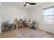Bright bedroom with wood floors, neutral walls, and a ceiling fan at 6099 N Netherland Ct, Aurora, CO 80019