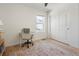 Bedroom with wood floors, neutral walls, and a white closet door at 6099 N Netherland Ct, Aurora, CO 80019