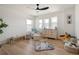 Bright Bedroom filled with natural light, featuring hardwood floors at 6099 N Netherland Ct, Aurora, CO 80019