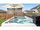 Backyard with a hot tub and wood privacy fence at 6099 N Netherland Ct, Aurora, CO 80019