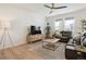 Cozy living room with neutral walls, wood floors, and comfortable seating area at 6099 N Netherland Ct, Aurora, CO 80019
