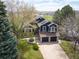 Beautiful, elevated view of the home showing the landscaped yard and neighborhood at 18 Brixham Ct, Castle Pines, CO 80108