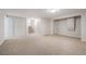 Spacious finished basement with neutral carpet and built-in storage at 18 Brixham Ct, Castle Pines, CO 80108