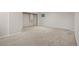 Large carpeted basement area with a small window at 18 Brixham Ct, Castle Pines, CO 80108
