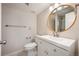 Bathroom featuring modern vanity, mirror, toilet, and updated fixtures at 18 Brixham Ct, Castle Pines, CO 80108