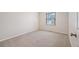 Cozy bedroom with large window and neutral walls at 18 Brixham Ct, Castle Pines, CO 80108