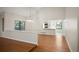 Dining area open to kitchen with hardwood floors at 18 Brixham Ct, Castle Pines, CO 80108