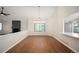 Elegant dining room area with hardwood floors and natural lighting at 18 Brixham Ct, Castle Pines, CO 80108