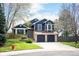 Inviting two-story home with a two-car garage, landscaped yard, and classic architectural details at 18 Brixham Ct, Castle Pines, CO 80108