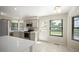 Bright kitchen features stainless steel appliances, white countertops, and an eat-in area with natural light at 18 Brixham Ct, Castle Pines, CO 80108