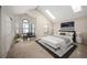 Bright main bedroom features skylights, vaulted ceilings and a luxury sitting area at 18 Brixham Ct, Castle Pines, CO 80108
