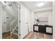 Hallway with vinyl floors, stairs, storage closet, and a decorative sideboard at 1470 S Quebec Way # 178, Denver, CO 80231