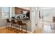 Modern kitchen featuring granite countertops, stainless steel appliances, and breakfast bar seating at 1470 S Quebec Way # 178, Denver, CO 80231