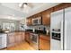 Features a spacious kitchen with stainless steel appliances, granite counters and updated wood cabinets at 1470 S Quebec Way # 178, Denver, CO 80231
