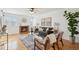 Cozy living room featuring a brick fireplace, hardwood floors, and comfortable seating at 1470 S Quebec Way # 178, Denver, CO 80231
