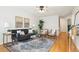 Bright living room with hardwood floors, modern furnishings, and stylish decor at 1470 S Quebec Way # 178, Denver, CO 80231