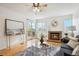 Inviting living room with a brick fireplace, sliding glass doors, and hardwood flooring at 1470 S Quebec Way # 178, Denver, CO 80231