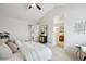 An open floorplan connects the main bedroom to an ensuite bathroom with natural light at 1470 S Quebec Way # 178, Denver, CO 80231