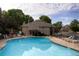 Sparkling community pool and clubhouse on a sunny day with plenty of seating available at 1470 S Quebec Way # 178, Denver, CO 80231