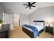Spacious bedroom with carpeted floor, ceiling fan, and ensuite bathroom at 12826 W Brittany Dr, Littleton, CO 80127