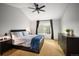 Spacious bedroom with carpeted floor and ceiling fan at 12826 W Brittany Dr, Littleton, CO 80127